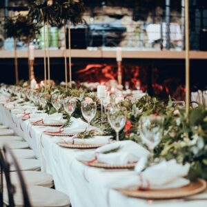 a long table is set for a formal dinner